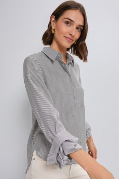 A cool-girl closet stapleA classic silhouette in a chic gray and white striped pattern, the Boyfriend Shirt from TWP is as classy as it gets. This top is made for a relaxed fit with a chest patch pocket, concealed front placket, and staple single roll button cuffs. Pair with everything from denim to maxi skirts for a positively chic look. Our Favorite Details: Long sleeves with button cuffs Concealed front button placket Front chest pocket Curved hem Relaxed fit Material: 100% CottonCare: Dry cl Classic Striped Blouse With Relaxed Fit, Classic Relaxed Fit Blouse With Vertical Stripes, Chic Vertical Stripes Office Shirt, Chic Office Shirt With Vertical Stripes, Classic Blouse With Vertical Stripes And Relaxed Fit, White Horizontal Stripe Top For Work, Business Casual Vertical Stripes Button-up Tops, Horizontal Stripe Long Sleeve Top For Work, Chic Vertical Stripes Shirt For Workwear