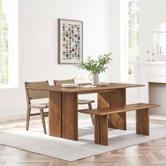 a wooden table with two chairs and a bench in front of a fire place oven