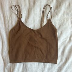 Brown Stretchy Cropped Spaghetti Strapped Shirt. Size S/M Seamless Cami Crop Top For Day Out, Trendy Strapped Tops For Day Out, Brown Camisole With Tank Straps For Spring, Summer Everyday Crop Top With Adjustable Straps, Casual Brown Cami Crop Top, Summer Crop Top Camisole For Everyday, Summer Tank Strap Top For Brunch, Brown Summer Camisole Cami, Cropped Summer Camisole For Everyday