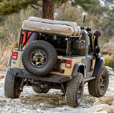 a jeep parked on the side of a rocky road