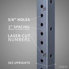 an image of the side of a metal pole with numbers and holes on each side