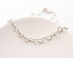 Dainty Heart Link Necklace in Sterling Silver Wrap yourself in some LOVE! Get the look of a chunky chain with this light and airy heart necklace that won't weigh you down or break your wallet. Looks surprisingly full and substantial, yet it's lightweight and comfortable to wear. Pretty on its own or layered with other minimal pieces.  Pair it with a matching bracelet: https://www.etsy.com/listing/1398010394/ FEATURES: * smooth and rounded heart links just flow and won't catch on a sweater, * the Enhypen Concert, Heart Chain Necklace, Layered Chain Necklace, Chain Loop, Heart Chain, Layered Chains, Necklace Heart, Matching Bracelet, Choker Necklaces