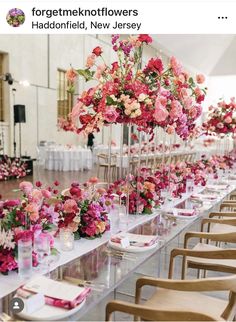 a long table with flowers and candles on it is set up for a formal function