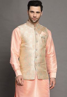 Art Silk Kurta in PeachThis Readymade attire is Enhanced with Buttons. Crafted in Chinese Collar Neck and Full SleeveAvailable with an Art Silk Pant in Peach and an Art Brocade Silk Nehru Jacket in PeachDo note: Brooch and Footwear shown in the image is for presentation purposes only. Half to one inch may vary in measurement. (Slight variation in actual color vs. image is possible) We sell all kinds of menswear. Mens Kurta | Mens Kurta Pajama | Mens Sherwani | Mens Sherwani Sets | Traditional Me Spring Wedding Pink Nehru Jacket, Traditional Pink Nehru Jacket For Spring, Pink Nehru Jacket For Festivals With Long Sleeves, Pink Long Sleeve Nehru Jacket For Festivals, Peach Embroidered Long Sleeve Set, Festive Peach Long Sleeve Sets, Indian Jackets, Vs Image, Mens Sherwani