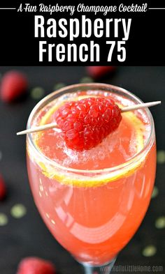 raspberry champagne cocktail in a glass with strawberries on the rim and text overlay that reads raspberry champagne cocktail