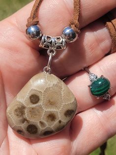 Handpolished Florescent PETOSKEY STONE NECKLACE paired with an Adjustable MALACHITE & QUARTZ Ring plus I always include extra goodies ♥️  I handpolished this PETOSKEY stone specimen to a satin shine ✨️ 😎 🥰 it is a beautiful light cream with brown corralite centers and bold corralite borders and septa lines .there is even a sorta heart shaped corralite 😍🥰  and I paired it with a stunning ADJUSTABLE MALACHITE RING this one is cut so it has gorgeous straight bands in so many shades of green  And it has faceted quartz crystals , one on each side .❤️️ I always include extra goodies starting with WATERLEVEL BANDED CARNEILAN TUMBLE , ,I always love to include a PETOSKEY STONE SPECIMEN and some other coral fossils and minerals from Lake Michigan (self collected) these fossils are even WAYY old Brown Square Pendant Jewelry For Gift, Unique Brown Jewelry For Everyday, Handmade Square Pendant Jewelry For Everyday, Brown Natural Stone Jewelry For Gifts, Spiritual Nickel-free Brown Jewelry, Brown Natural Stone Jewelry As A Gift, Brown Natural Stone Jewelry Gift, Collectible Spiritual Rectangular Jewelry, Nickel-free Brown Jewelry For Gifts