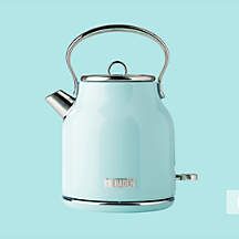 an electric tea kettle on a blue background