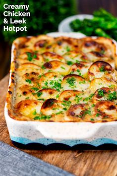 a cheesy chicken and leek hotpot with broccoli in the background