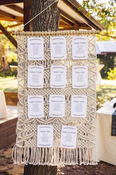 the seating cards were hung from a tree