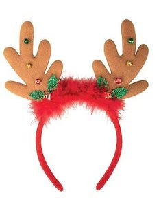 a red headband with reindeer antlers and green beads on it's ears