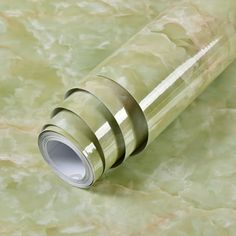 a close up of a glass tube on a marble surface