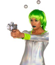 a woman with bright green hair holding a silver object in her right hand and looking at the camera