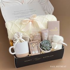 a gift box filled with coffee, tea and other items for someone's special occasion