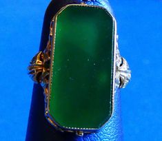 Stunning chrysoprase ring set in an 18K white gold antique style mounting.  Called the stone of Venus, Chrysoprase is more valuable than other chalcedony and can sometimes be mistaken for imperial jade or emerald.  It is also known to be associated with healing and positive properties. The ring is marked 18K, is a size 6 and weighs approximately 3.6 dwt. Imperial Jade, Chrysoprase Ring, Antique Style, Rings Statement, Ring Set, Ring Sets, Statement Rings, Jade, Emerald