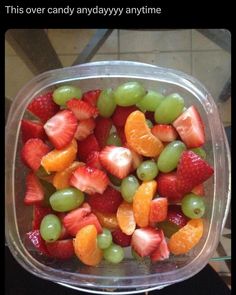 a plastic container filled with lots of fruit