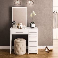 a dressing table with a stool and mirror on it in front of a gray wall