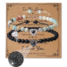 three bracelets with i love you written on the front and two charms attached to them