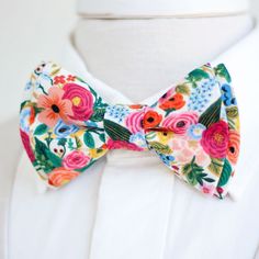 "Dapper Men's Garden Party In Cream Bow Tie Made By The Belle And The Beau! ♥ This beautiful cotton floral fabric is part of our new Wildwood Collection designed by Rifle Paper Co! We have been approved by Rifle Paper Co to make our products in these fabrics- that means we will be ordering bolts regularly! Yay! Our dapper, modern, stylish, and charming neckties are perfect for everyday, Sunday best, all special occasions, photography sessions, and especially dapper on grooms and groomsmen! They Bowties Men's, Groomsmen Bowtie, Floral Bow Tie, Pre Tied Bow Tie, Wedding Order, Dapper Men, Mens Bow Ties, Large Weddings, Tie Accessories