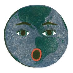 an image of a face painted on the side of a round object with green and red paint