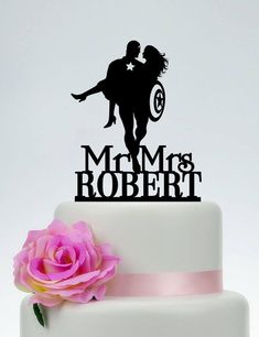 a wedding cake topper that says,'mr and mrs robert '