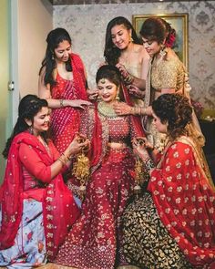 the bride and her bridals getting ready for their wedding