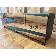 the sideboard is made out of wood and has a blue stripe on it,