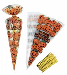 halloween treat bags with candy sticks and stickers on them, one has a jack - o'- lantern design