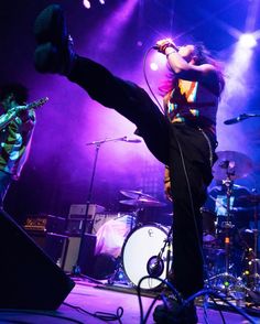 a man standing on one leg with his legs up in the air as he performs