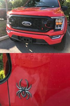 the front end of a red truck with a spider emblem on it's grille