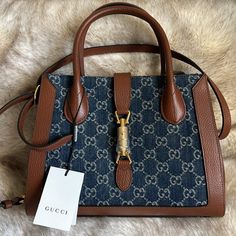 Brand New Item With Tag. Dust Bag And Box Included. Style 649016 2kqgg 8375 Material: Gg Jacquard Denim And Leather Color: Dark Blue And Brown Made: Italy All Dimensions Are Approximate: (Hxwxd): 21cm X 29.5cm X 11cm / 8.26'' X 11.61'' X 4.33'' Accessories: Shoulder Strap Designer Bags With Horsebit Detail For Shopping, Designer Bags With Horsebit Detail, Luxury Bags With Horsebit Detail For Shopping, Rectangular Shopping Bags With Horsebit Detail, Brown Rectangular Bag With Horsebit Detail, Rectangular Shopping Bag With Horsebit Detail, Designer Shopping Bags With Horsebit Detail, Luxury Brown Bags With Horsebit Detail, Gucci Bag With Horsebit Detail For Shopping