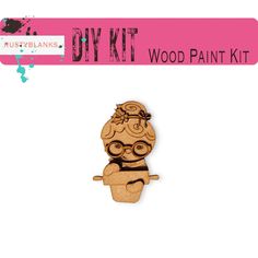 a wooden craft kit with an image of a woman sitting on top of a cup