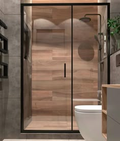 a bathroom with a toilet, sink and shower stall in the corner next to a wooden paneled wall