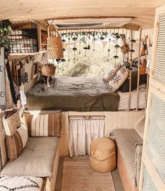 the inside of a small camper with lots of furniture and decor on it's walls