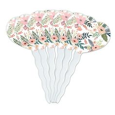 four paper plates with flowers and leaves on them