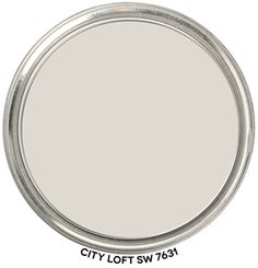 a round metal tray with the words classic gray painted on it's sides and bottom