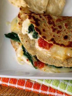 a close up of a plate of food with tortilla