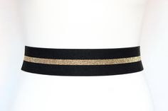 "Black Stretch Women's belt Elastic belt Waist cincher belt Very wide, Black with Gold stripe Wide 2 inch or 5 cm. The pictures are taken on 25\" waist mannequin. Fastens with Hook and eyes closure. Powerful and fantastic! This belt is not sturdy but soft and you need to choose the right size. WHEN ORDERING: Extra small (0-2) Fits waists 23\" - 25\" Measures 21.5\" end to end including clasp Small (4-6) Fits waists 26\" - 27\" Measures 24 1/2\" end to end Medium (8-10) Fits waists 28\" - 29\" Me Cincher Belt, Waist Cincher, Gold Stripes, Black Stretch, Black Belt, Belts For Women, Black Silver, Elastic, 10 Things