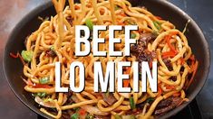 beef lo mein in a skillet with the words beef lo mein over it's image