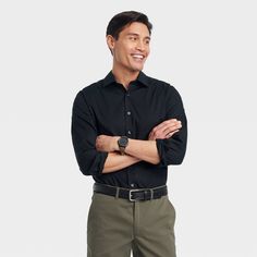 From work meetings to evening outings, stay cool, comfy and stylish in this Performance Dress Long-Sleeve Button-Down Shirt from Goodfellow & Co™. Tailored in a standard fit, this button-down shirt is crafted from a soft fabric blend with a hint of spandex for stretchy comfort. Designed with a collared neckline for classic style, you can wear it tucked in with dress pants or chinos with loafers or dress shoes for a special event, or sport it untucked with jean shorts or chambray pants for a more Chambray Pants, Target Dress, Performance Dresses, Button Down Dress, Button Dress, Black Button, Stay Cool, Chambray, Dress Shirt