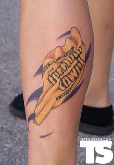 a close up of a person with a tattoo on their leg