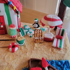 a table topped with lots of cakes and decorations