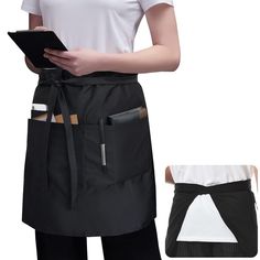 a woman wearing an apron and holding a tablet