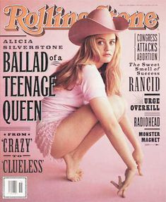 a magazine cover with a woman in a pink dress and cowboy hat on the cover