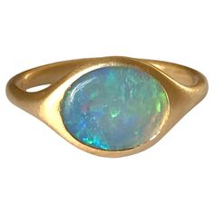 Dalben design 18k yellow gold satin finishing ring with a 1 carat bezel-set oval shape Australian crystal opal . Ring size US 6 - EU 51 re-sizable to most finger sizes. Bezel setting dimension: width 11 mm, height 9,2 mm. The ring has been designed and handcrafted in our atelier in Italy Como with a rigorous quality workmanship . Modern 14k Gold Opal Ring, Oval Opal Rings With Polished Finish, Fine Jewelry Oval Opal Ring With Polished Finish, Modern Oval Yellow Gold Opal Ring, Modern Gold Oval Opal Ring, Oval Gold Opal Ring In 14k Gold, Modern Yellow Gold Oval Opal Ring, Oval Opal Ring With Polished Finish In Fine Jewelry, Modern Oval Opal Ring In Yellow Gold