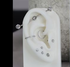 an ear is shown with some diamonds on it and the rest of the ear has been made out of plastic