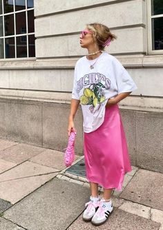 Pink satin skirt with graphic T-shirt and Adidas Samba | Adidas Samba Outfits Street Style Summer Outfits Inspiration, Colorful Fits, Taylor Outfits, Funky Style, Cosmetology School