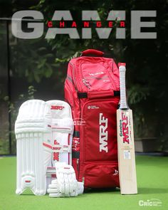 a red bag and some white cricket equipment