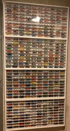 the wall is full of different types of toy cars