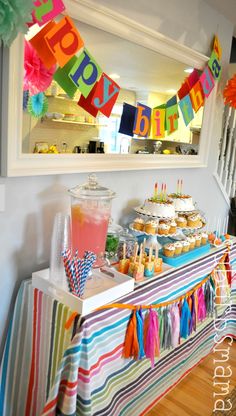 a colorful birthday party with cupcakes and drinks