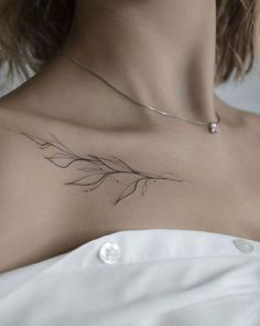 a woman with a tattoo on her chest